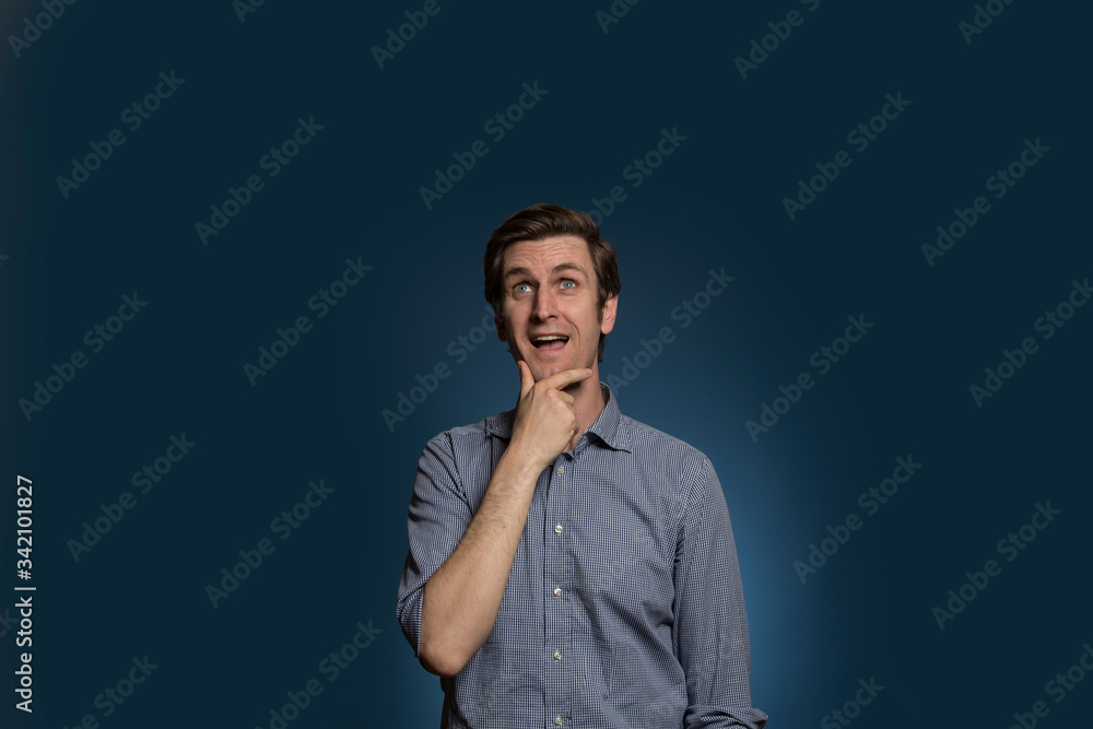 Man with Hand On Chin Thinking and Smiling Man with Hand On Chin Thinking and Smiling