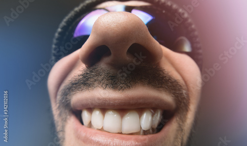 Tableau sur toile Funny distorted face portrait. Focus on the nose.