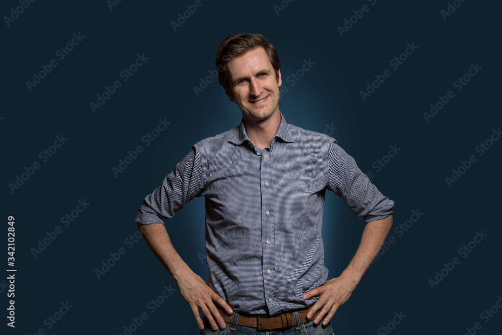 Fototapeta premium Man with Hands on Hips Smiling