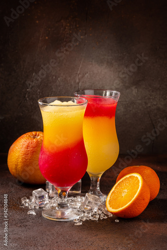 Delicious cold refreshing colorfull smoothie drinks in cocktail glases with fruits photo