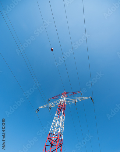 Electric pole in the center of the beautiful green fields