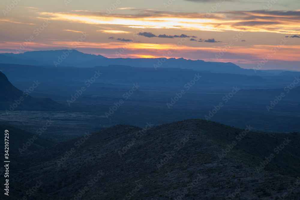 Sunset in the desert with mountains