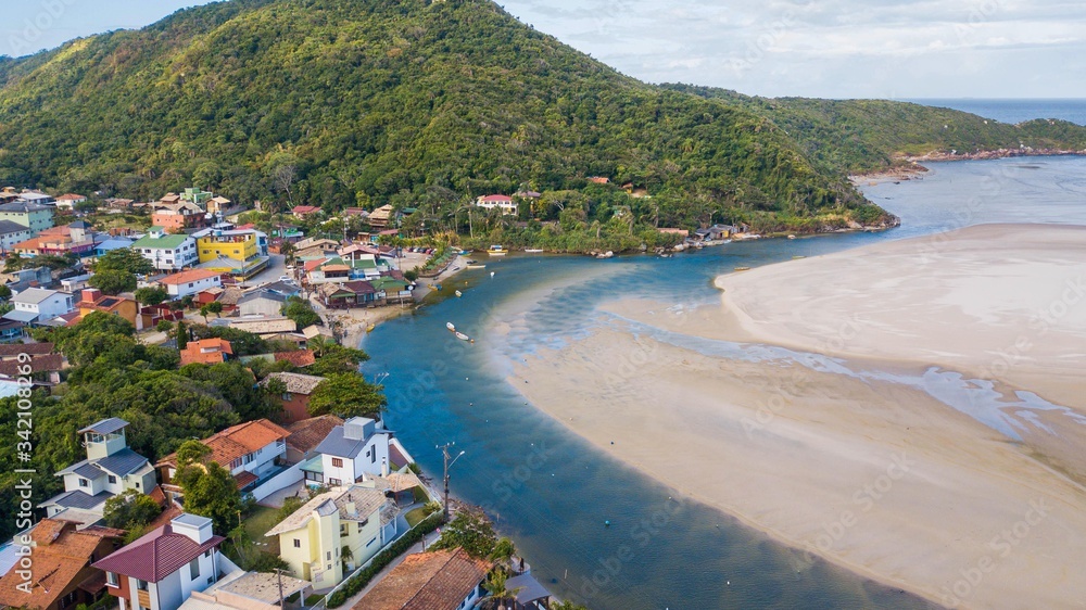 Beautiful landscape of the village of Guarda do Embaú. Aerial view of the mouth of the Madre River in Guarda do Embaú, Santa Catarina, Brazil