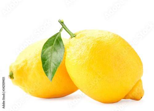 Lemons with a green leaf on a white background. Isolated