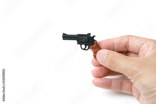 Hand Holding Tiny Model Pistol Gun on White Background 