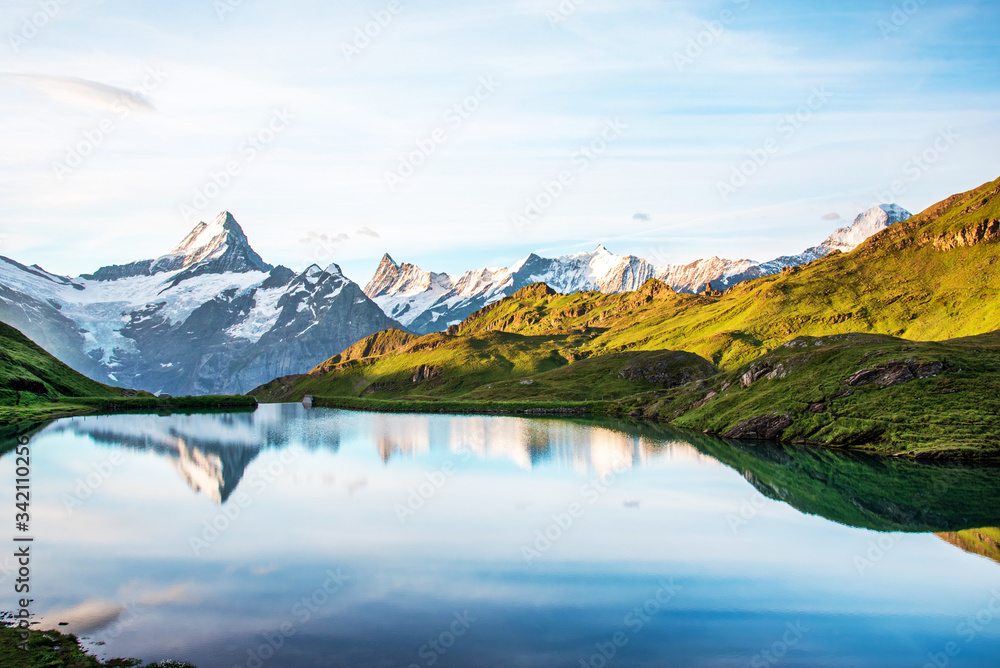 Breathtaking beautiful scenery on the lake in the Swiss Alps. Wetterhorn, Schreckhorn, Finsteraarhorn et Bachsee. Exciting places. (relaxation, harmony, anti-stress - concept).