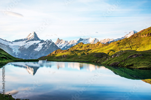 Obraz na płótnie Breathtaking beautiful scenery on the lake in the Swiss Alps. Wetterhorn, Schreckhorn, Finsteraarhorn et Bachsee. Exciting places. (relaxation, harmony, anti-stress - concept). w salonie