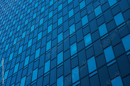 blue glass wall of a skyscraper