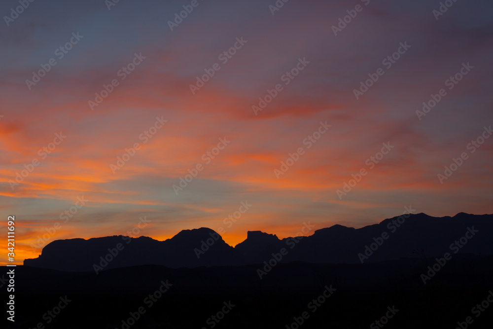 Sunset in the desert with mountains