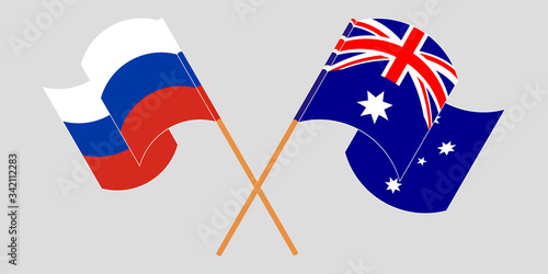 Crossed and waving flags of Australia and Russia