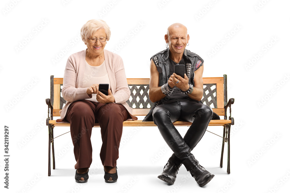Elderly woman and a punk sitting on a bench and using mobile phones Elderly woman and a punk sitting on a bench and using mobile phones