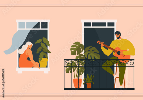 The concept of social isolation during the coronavirus pandemic. People playing musical instruments guitar on balconies. Stay home quarantine.