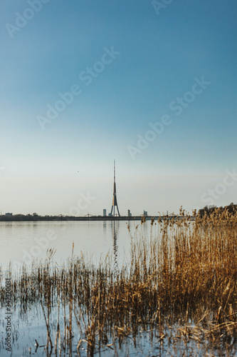 Riga  Latvia. Cityscape In Sunny spring day. View Of Famous Landmark - Riga Television Tower. Scenic View