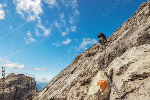A challenging ascent on a mountain peak, dolomite Alps, Italy