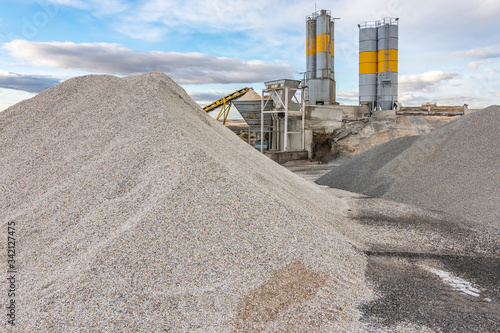 Quarry for the extraction of sand and stone, its transformation into gravel and cement manufacturing