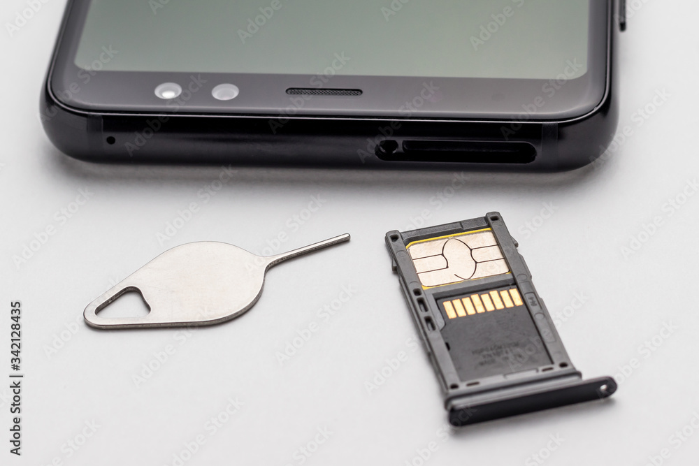 The hybrid tray with a SIM card and a memory card is removed from the smartphone with a special tool. The hybrid tray with a SIM card and a memory card is removed from the smartphone with a special tool.