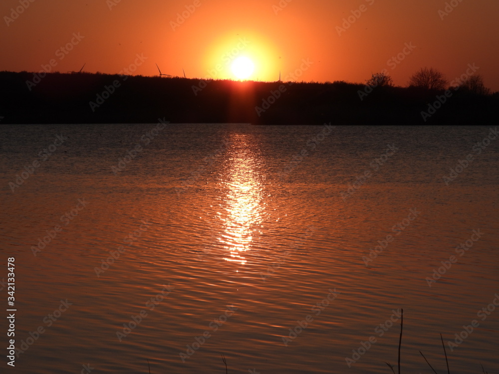 Naklejka premium sunset on the river