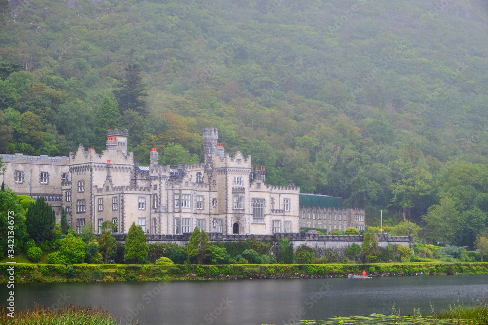 Kylemore Abbey in Connemara, County Galway, Ireland, during a rainy day.