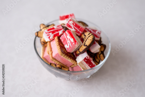 sweets in a bowl on a white background