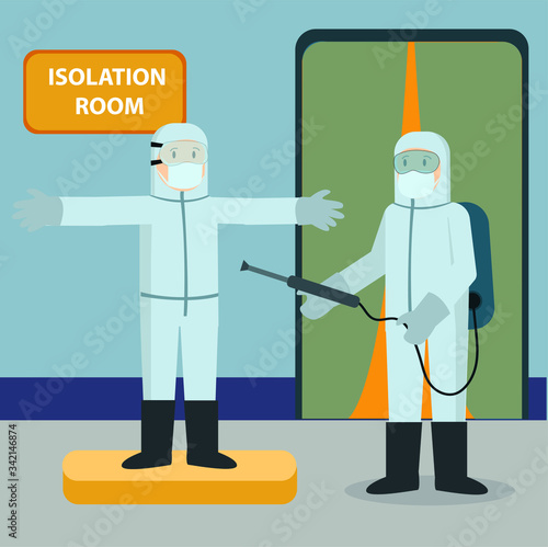 Medical staff is spraying disinfectant to his partner before entering isolation room