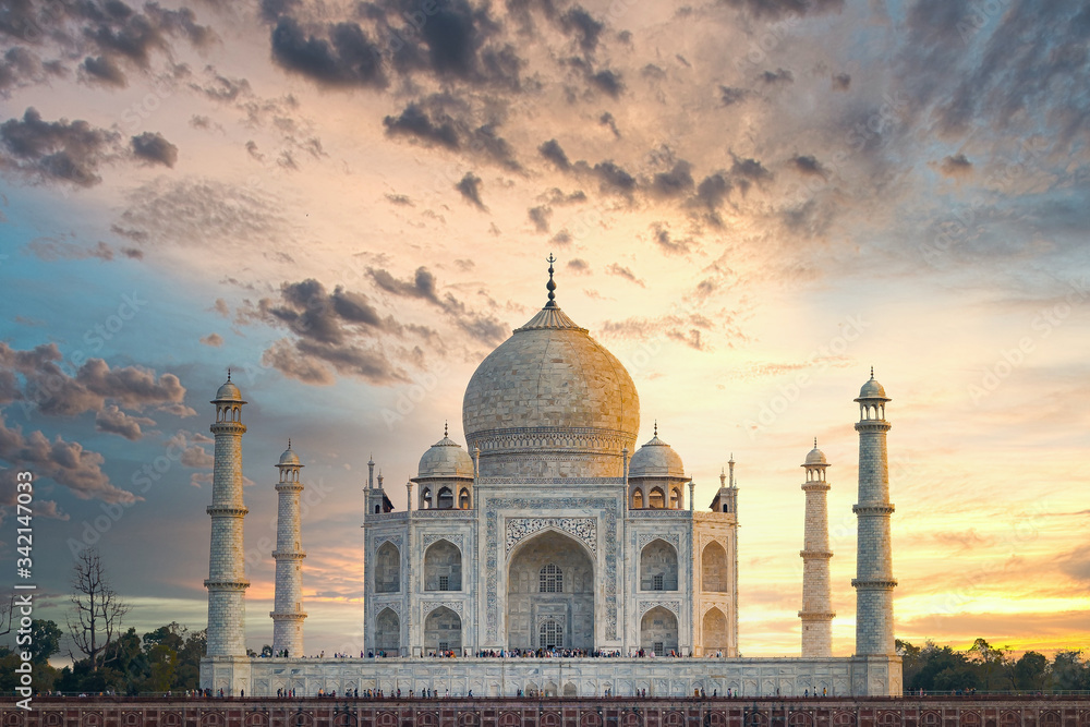 Taj Mahal scenic sunset view with moody sky. A UNESCO World heritage site at Agra, India