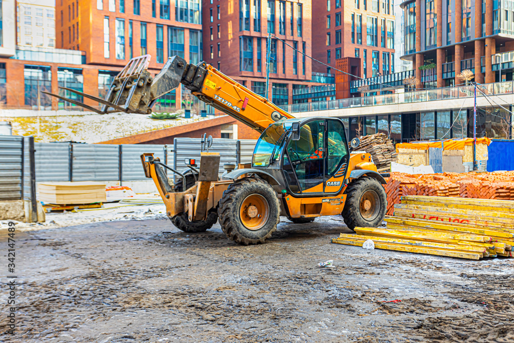 escavator on the construction site of a residential complex of houses escavator on the construction site of a residential complex of houses