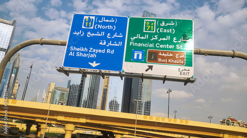 Dubai traffic signs over the road. United Arab Emirates. photo