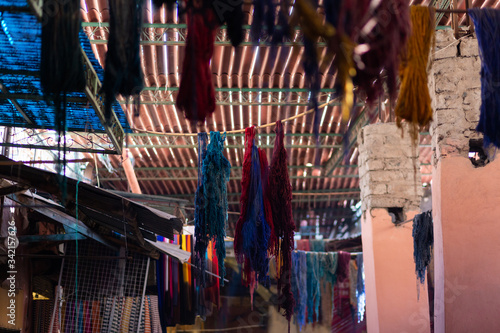 Multicolor of raw silk threads are hanging after dyed color in the historic Souk of Marrakech © bonilla1879