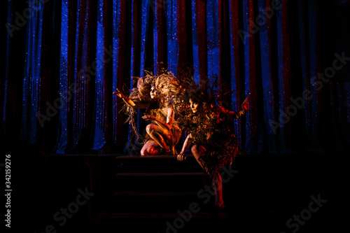 Ghost girls, spirits of the theater, before the scenes on the stage of the theater.