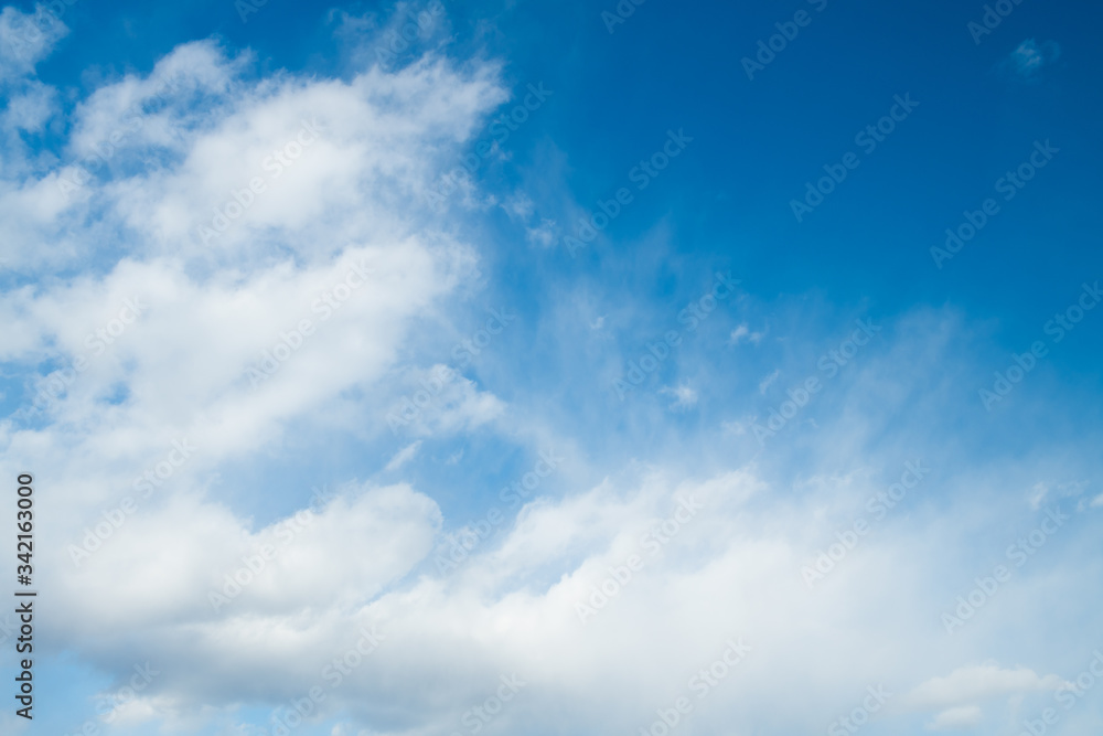 Fototapeta premium Abstract blue sky background with clouds