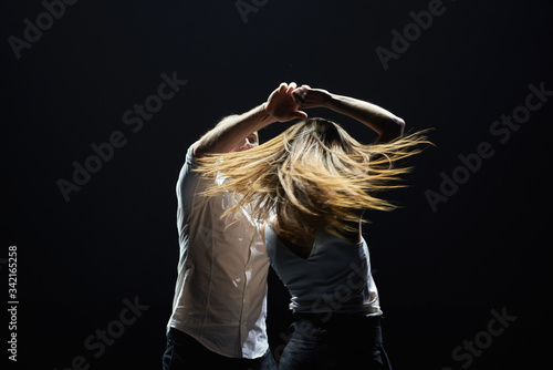 Professional dancers perform latino dance. Passion and expression photo