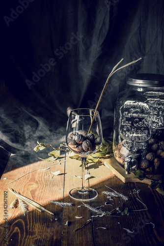 vintage wood table with a glass of nuts