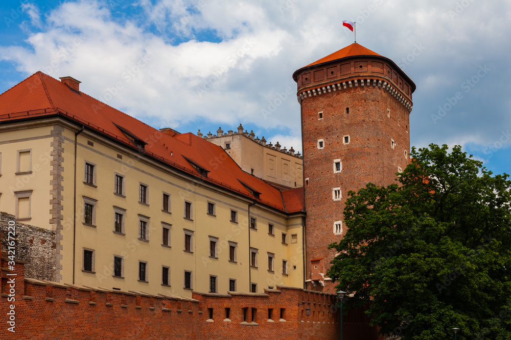 Fragment of the fortress wall of the royal castle with a watchtower in Krakow (Poland)