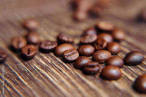 Bag of roasted coffee beans on a dark background with burlap fabric  close view. Coffee beans background. Coffee beans close-up  selective focus  shallow depth of field.