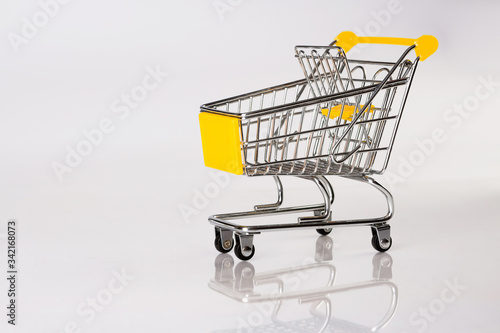 Side view of empty trolley with reflection on white background