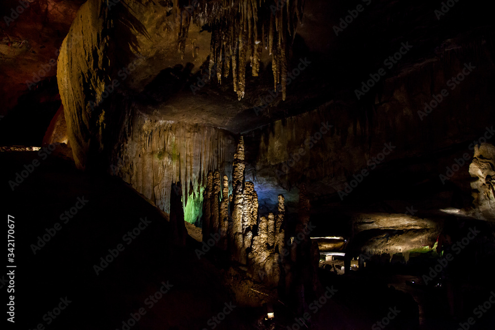 cave with rock growths with illumination