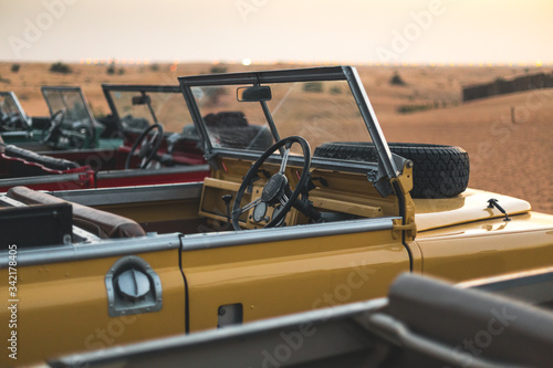 Multiple old Land Rover in the desert of Dubai - UAE