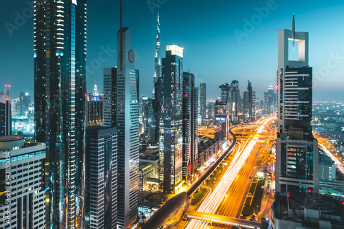 Long exposure view of traffic and skyline from rooftop at night Dubai - UAE