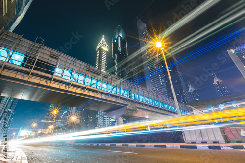 Long exposure of cars passing on highway in front of skyscrapers Dubai - UAE