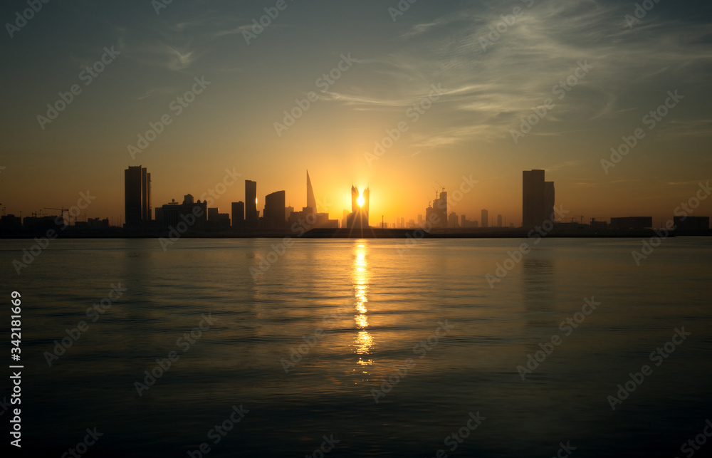 Bahrain skyline and the sun during dusk