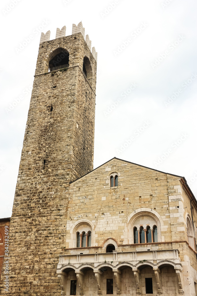 Brescia, Italy. View of famous historical landmark (Torre del Pegol and Palazzo del Broletto) in Brescia.