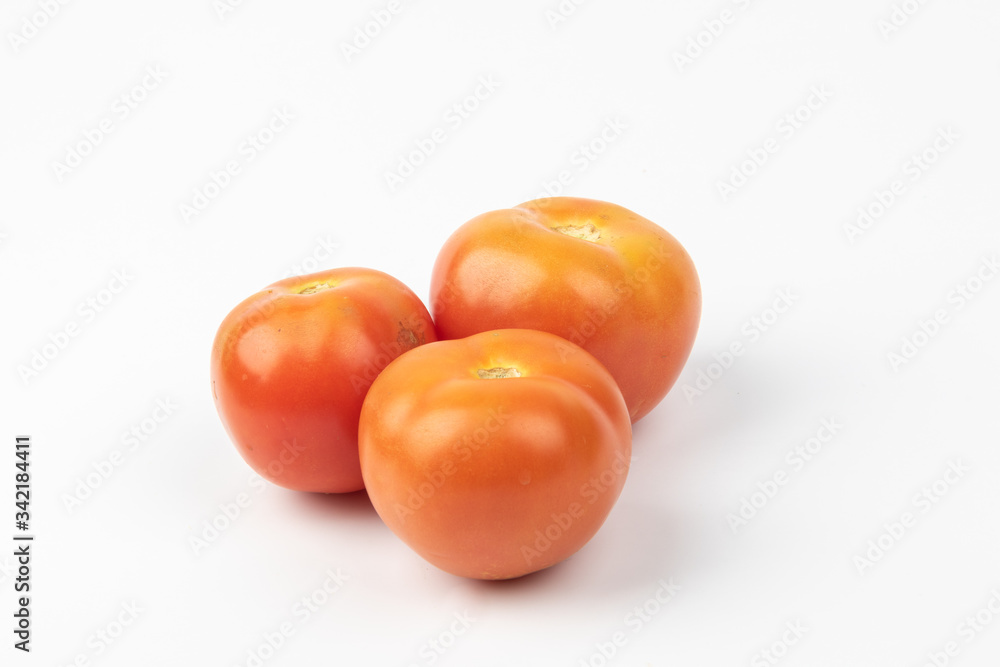 Fresh raw tomato isolated on white background. Fresh raw tomato isolated on white background.