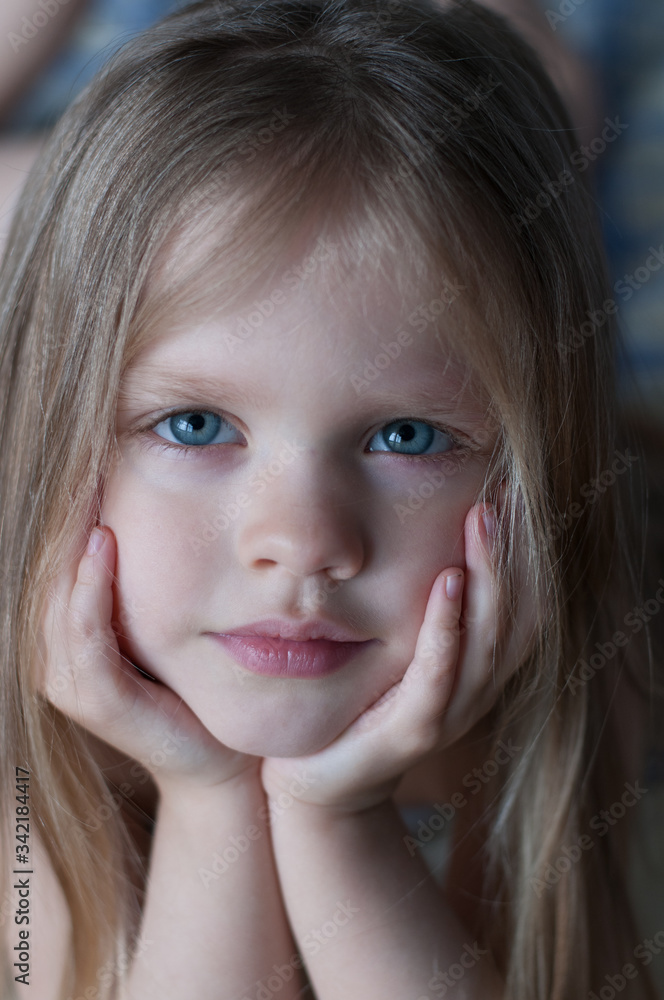 Portrait of a little girl with white hair and blue eyes Portrait of a little girl with white hair and blue eyes