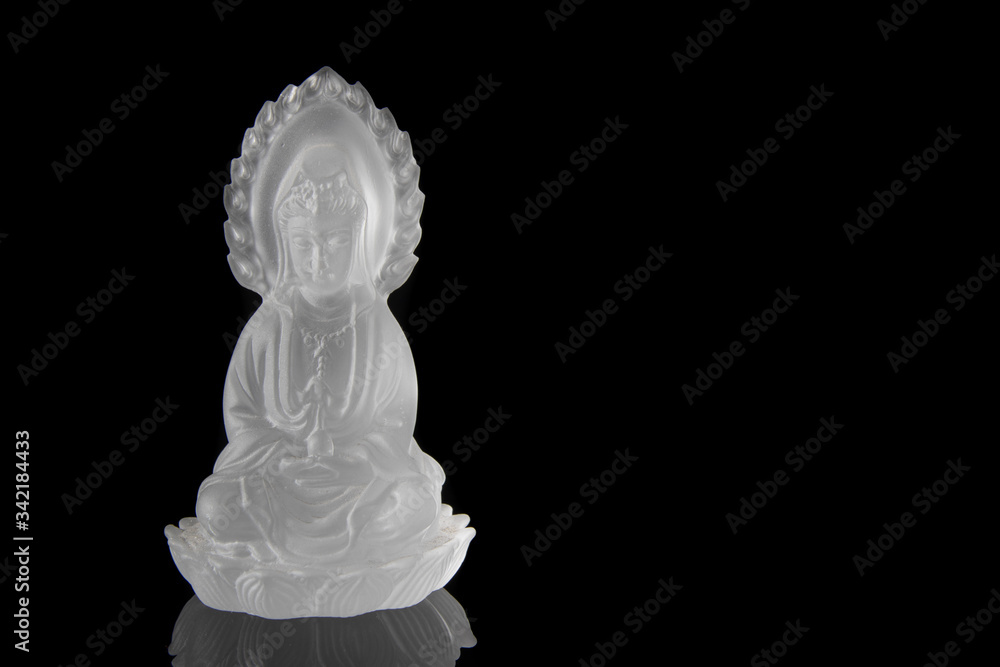 Crystal Guan yin or Quan Yin statue on black background, Chinese sculpture