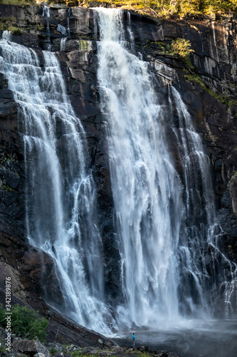 Skjervefossen norwegian landmark high powerful cascade waterfall. Nature travel clean falling water vertical landscape