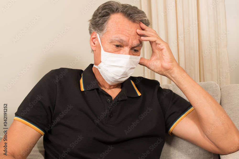 Senior Man at home wearing his face mask     