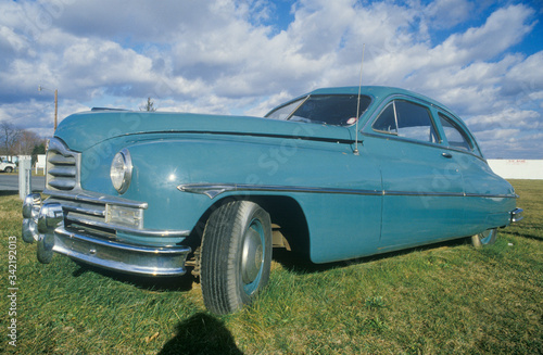 An old light blue car
