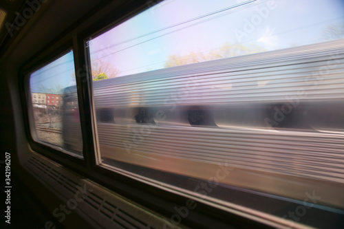 Photography View of Amtrak train car from another moving Amtrak train, Philadelphia, Pennsyl