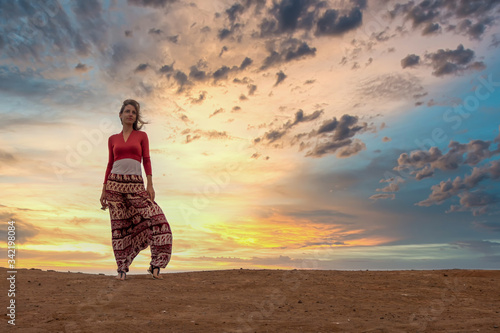 Woman and Dramatic Sunset in Peru (ID: 342198084)