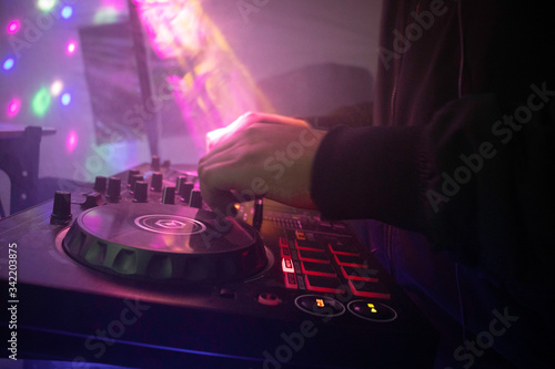 disc jockey mixing at dj party